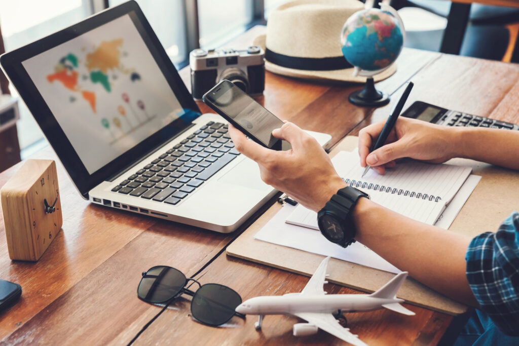 Young men planning vacation trip and searching information